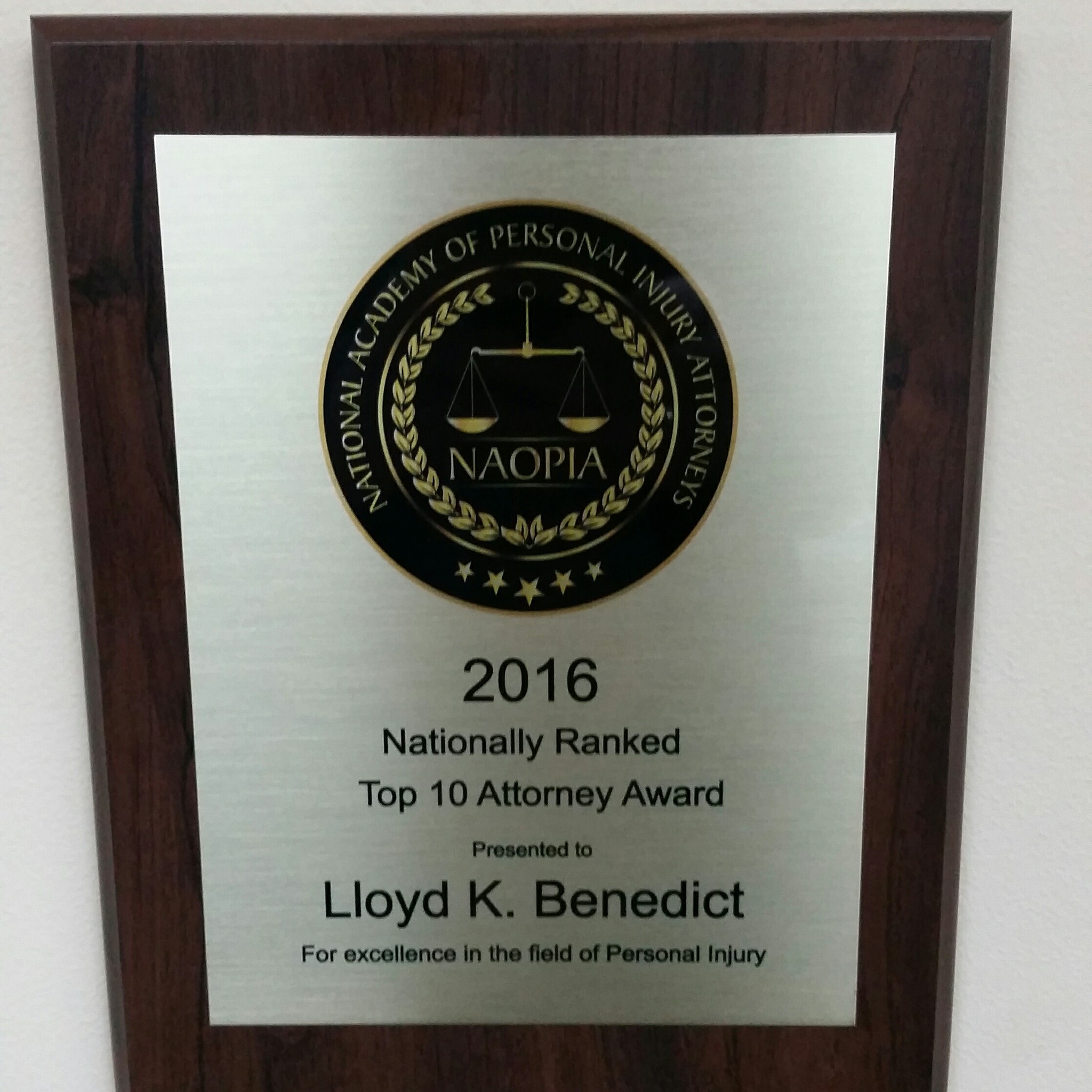 Top 10 Attorney 2016 award plaque for Lloyd K. Benedict