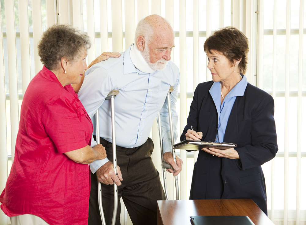 injured man consulting a lawyer